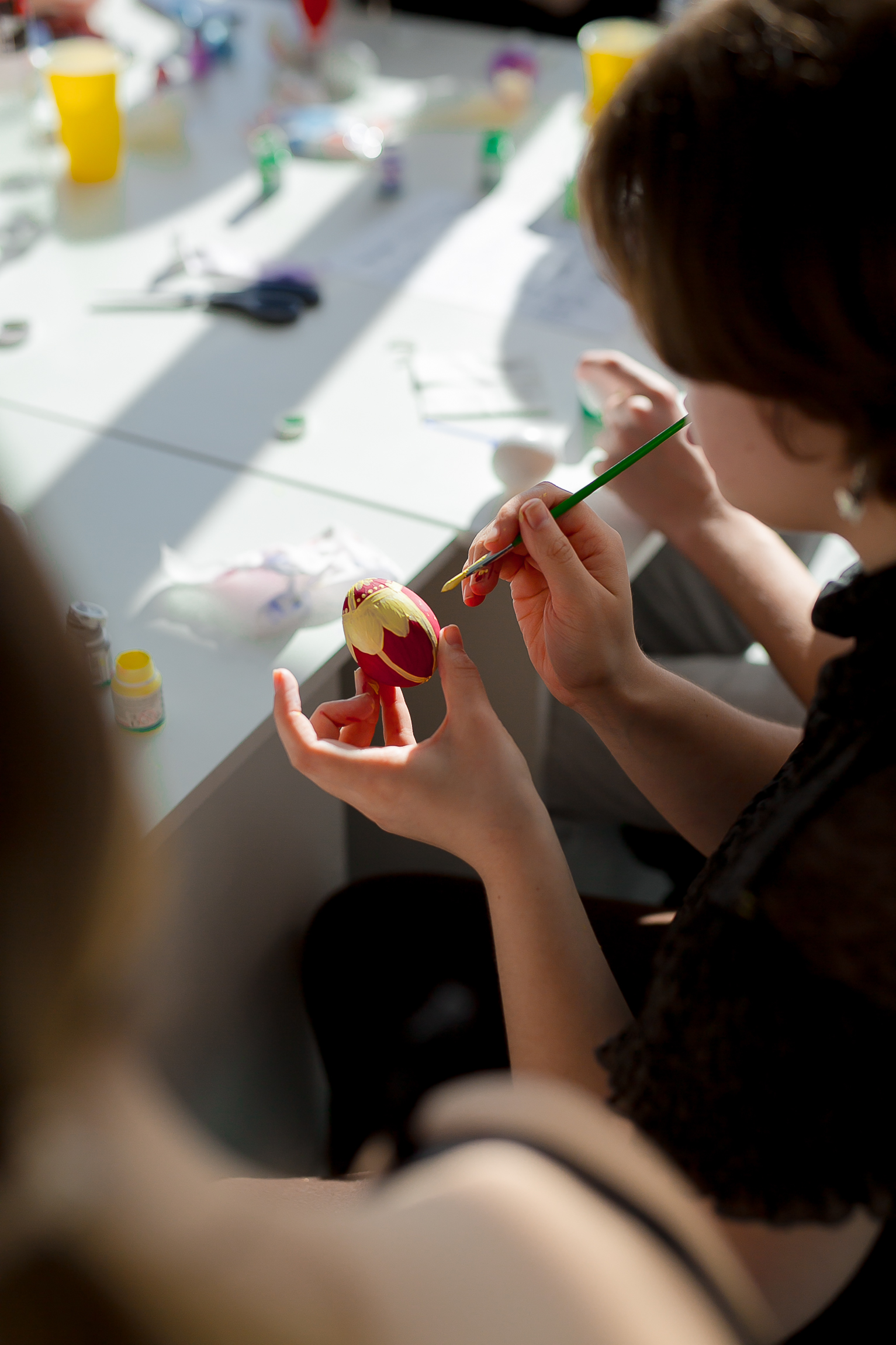 People painting eggs